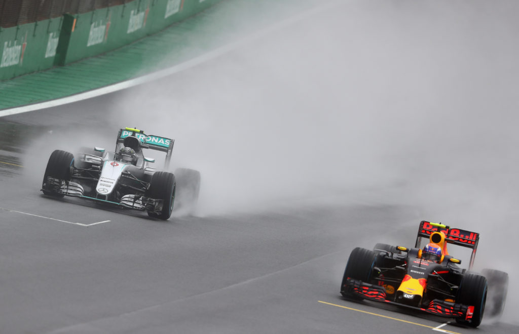 SAO PAULO, BRAZIL - NOVEMBER 13:  Max Verstappen of the Netherlands driving the (33) Red Bull Racing Red Bull-TAG Heuer RB12 TAG Heuer overtakes Nico Rosberg of Germany driving the (6) Mercedes AMG Petronas F1 Team Mercedes F1 WO7 Mercedes PU106C Hybrid turbo on track during the Formula One Grand Prix of Brazil at Autodromo Jose Carlos Pace on November 13, 2016 in Sao Paulo, Brazil.  (Photo by Clive Mason/Getty Images)